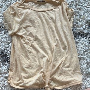 Yellow shirt with a tie in front